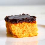 A slice of Brazilian carrot cake with chocolate frosting.