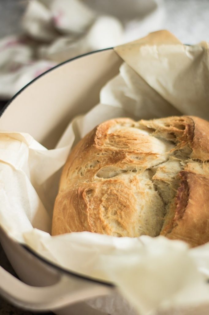 beer bread inside dutch oven, baked, with parchement paper