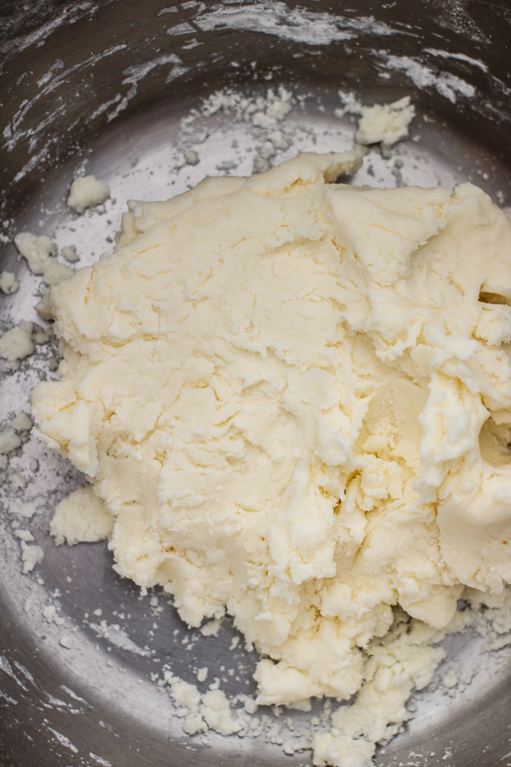 Premium Photo  Hand stirring the mixture in mixing bowl with spoon for  baking brazilian cheese bread