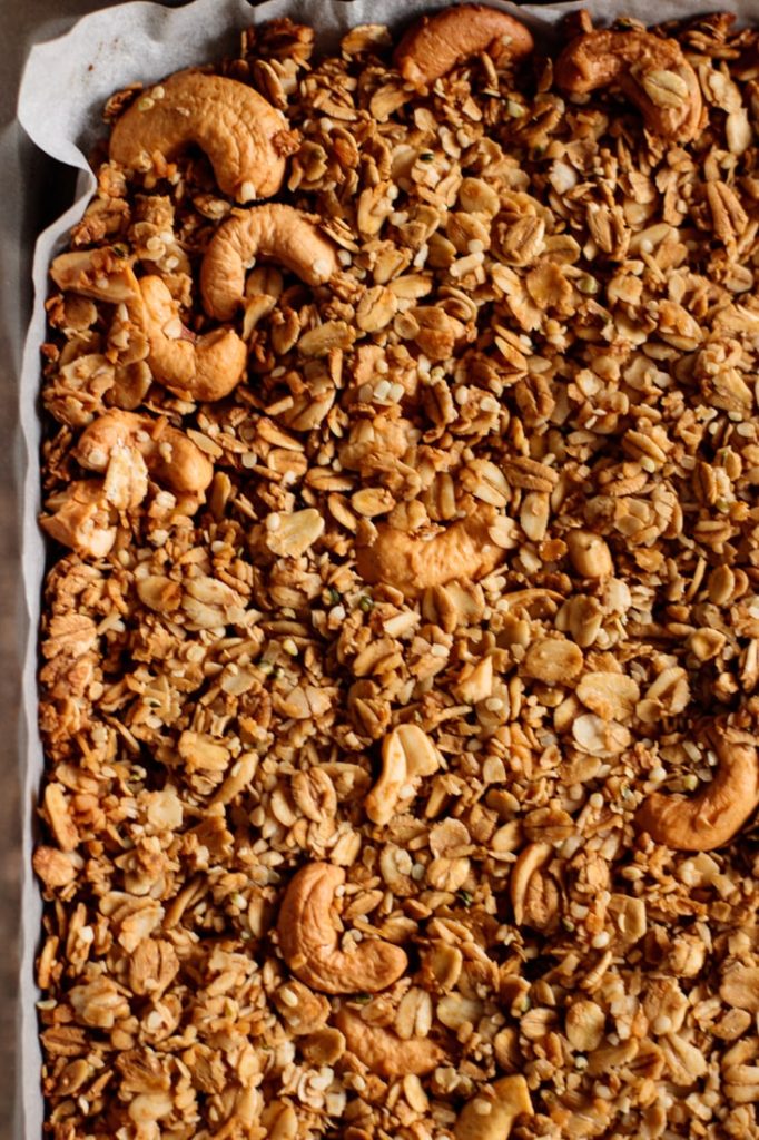 baked granola resting on sheet pan