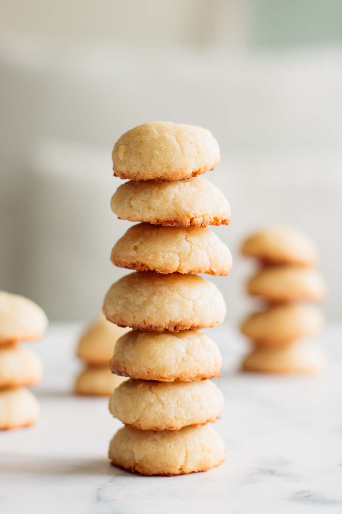 Stacks of coconut cream cheese cookies.