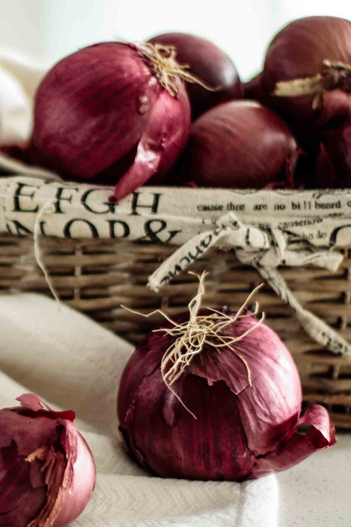 Red onions in a basket.