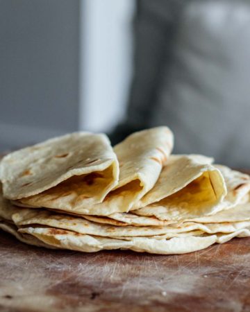a stack of sourdough tortillas