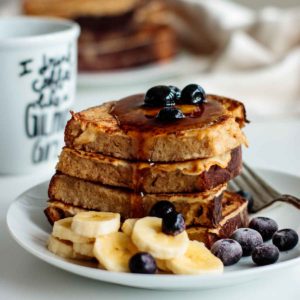 sourdough french toast with butter, berries, bananas and maple syrup