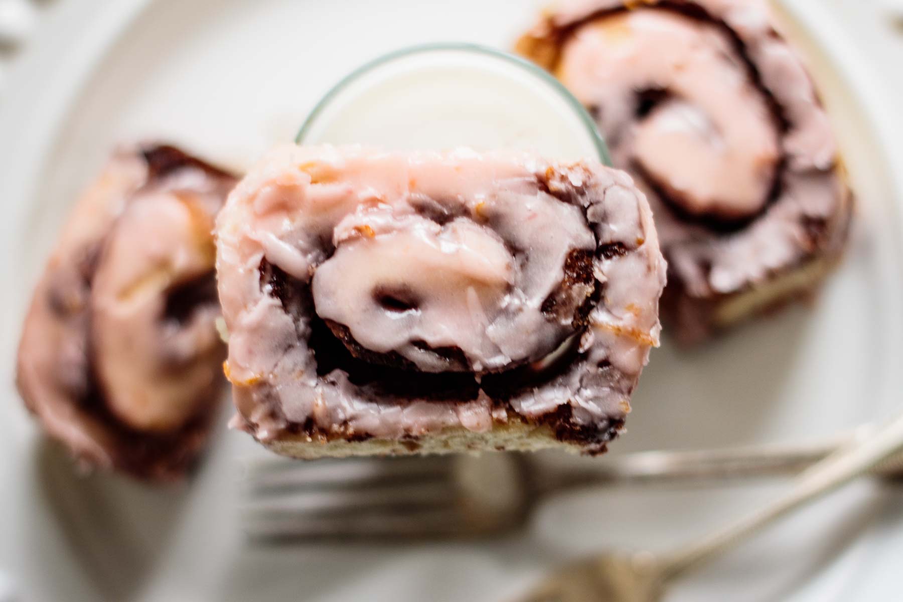 blood orange cinnamon rolls and a glass of milk