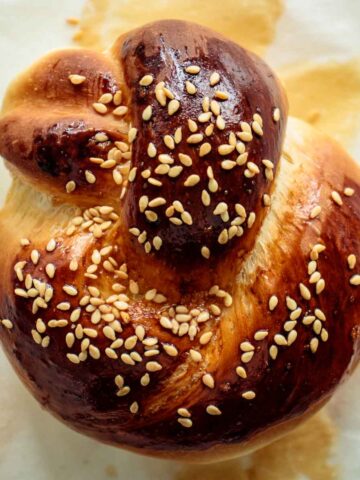 close up of a challah roll, just baked
