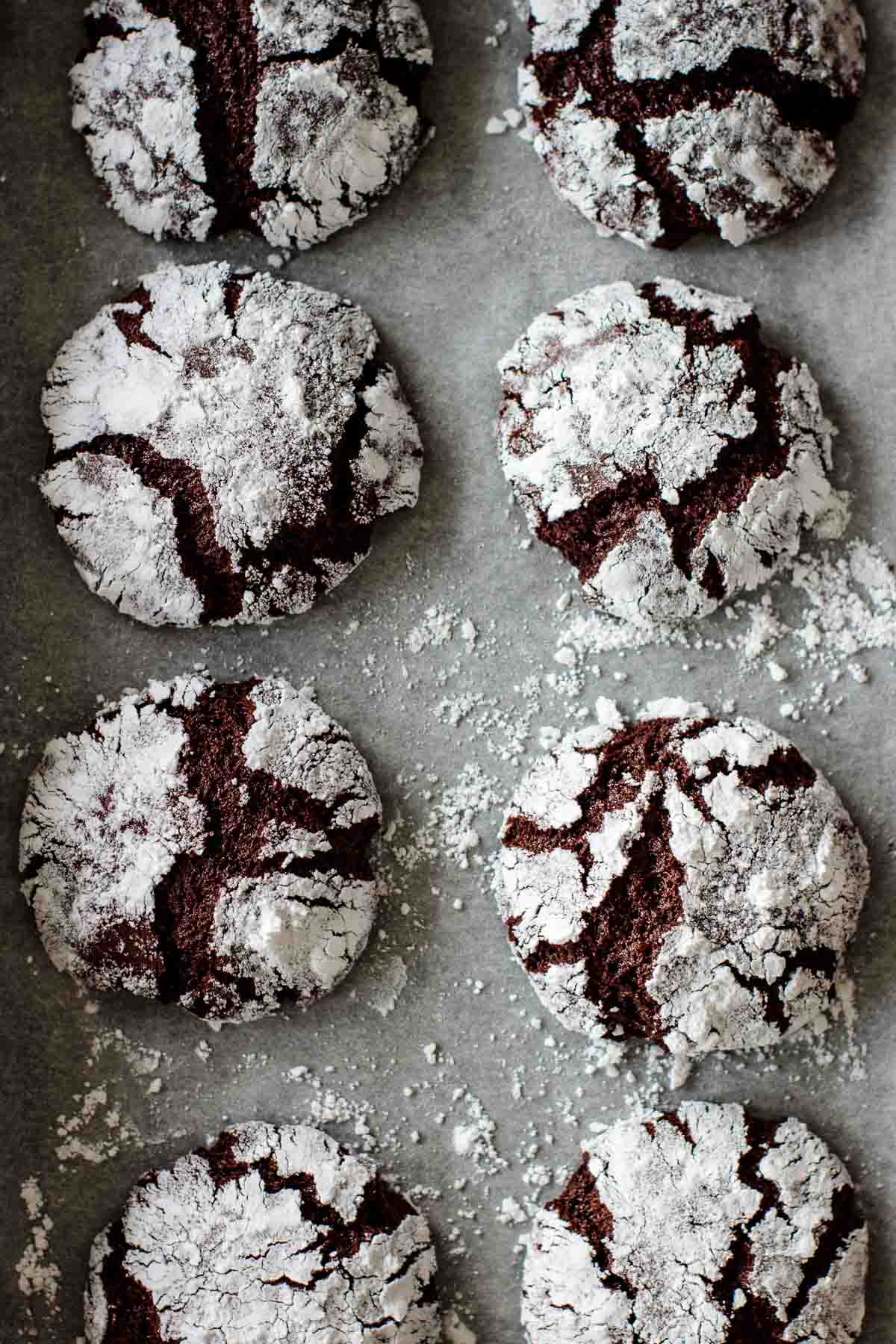 A baking sheet full of baked chocolate crinkles.