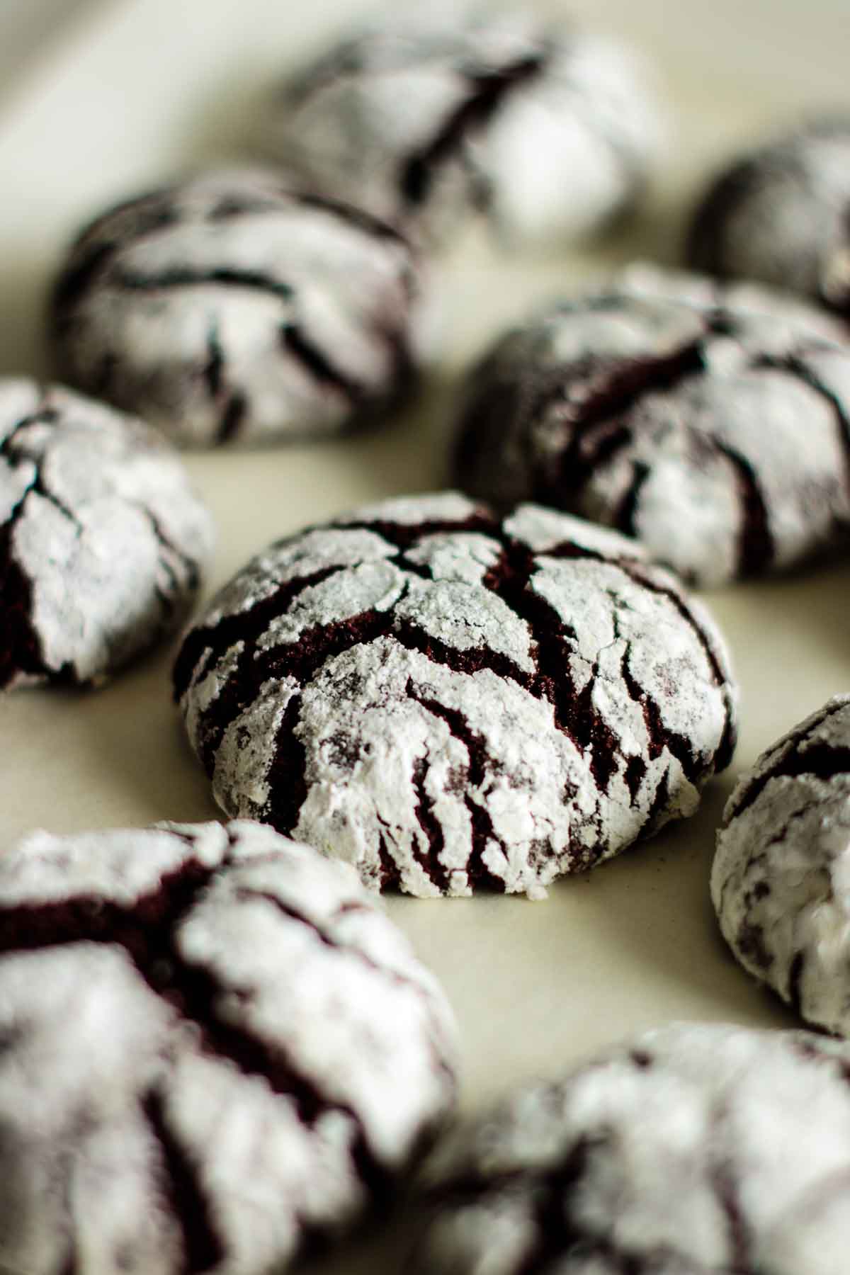 Chocolate crinkle cookies in a baking pan.
