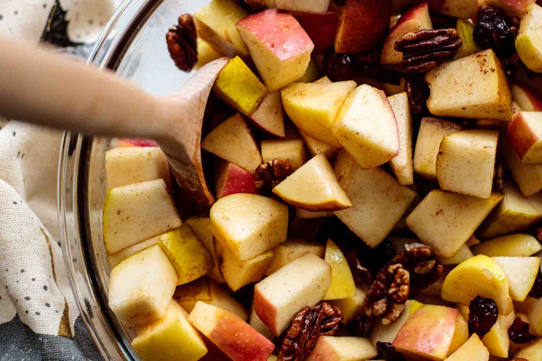 flat lay of fall fruit salad, showing apples, pears, pecans and cranberries