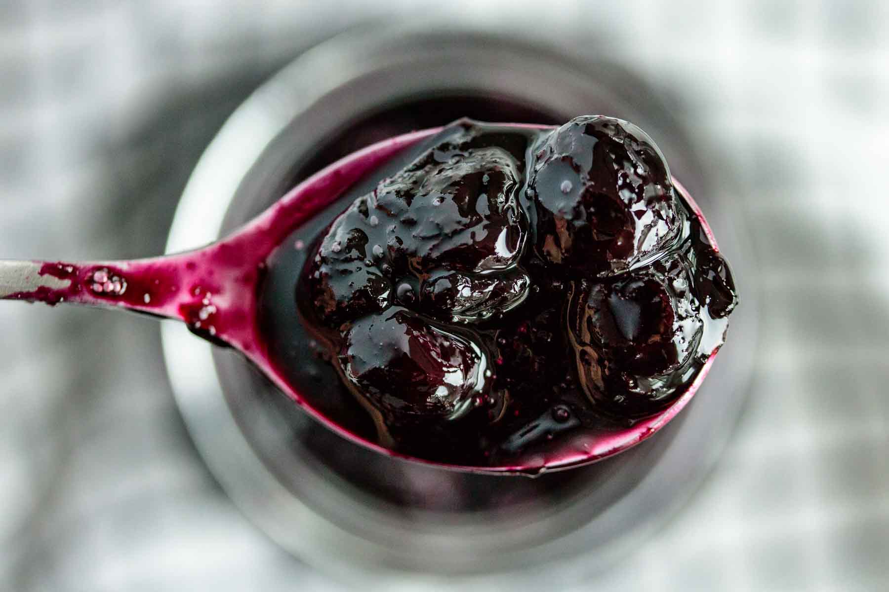 close up of blueberry topping in a spoon