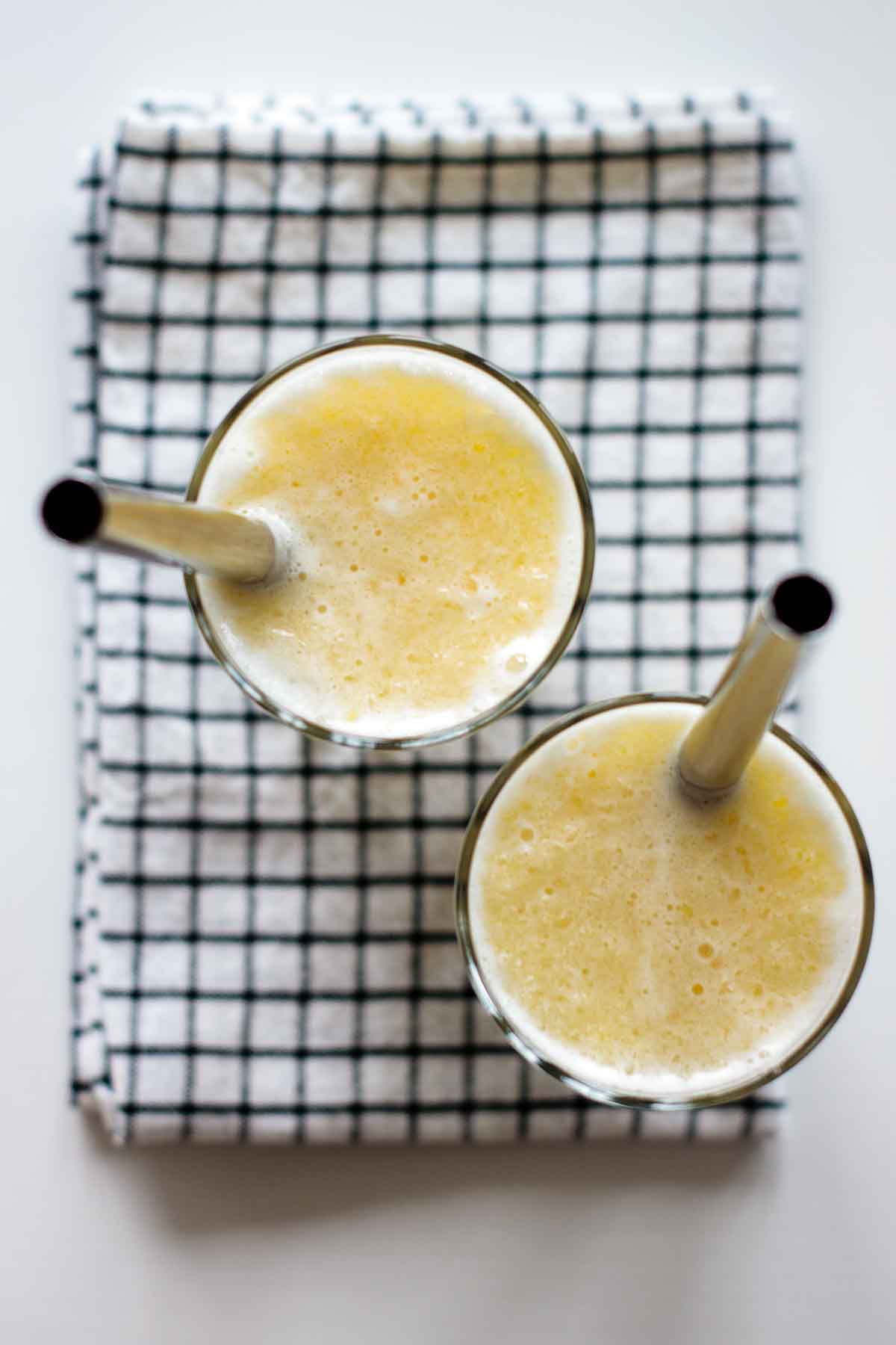 smoothies seen from above, with steel straws