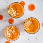three glasses of turmeric smoothies seen from above