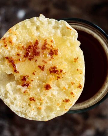 sourdough english muffin toasted over a cup of coffee