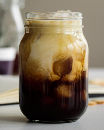 Iced Brown Sugar Oatmilk Shaken Espresso served in a mason jar.