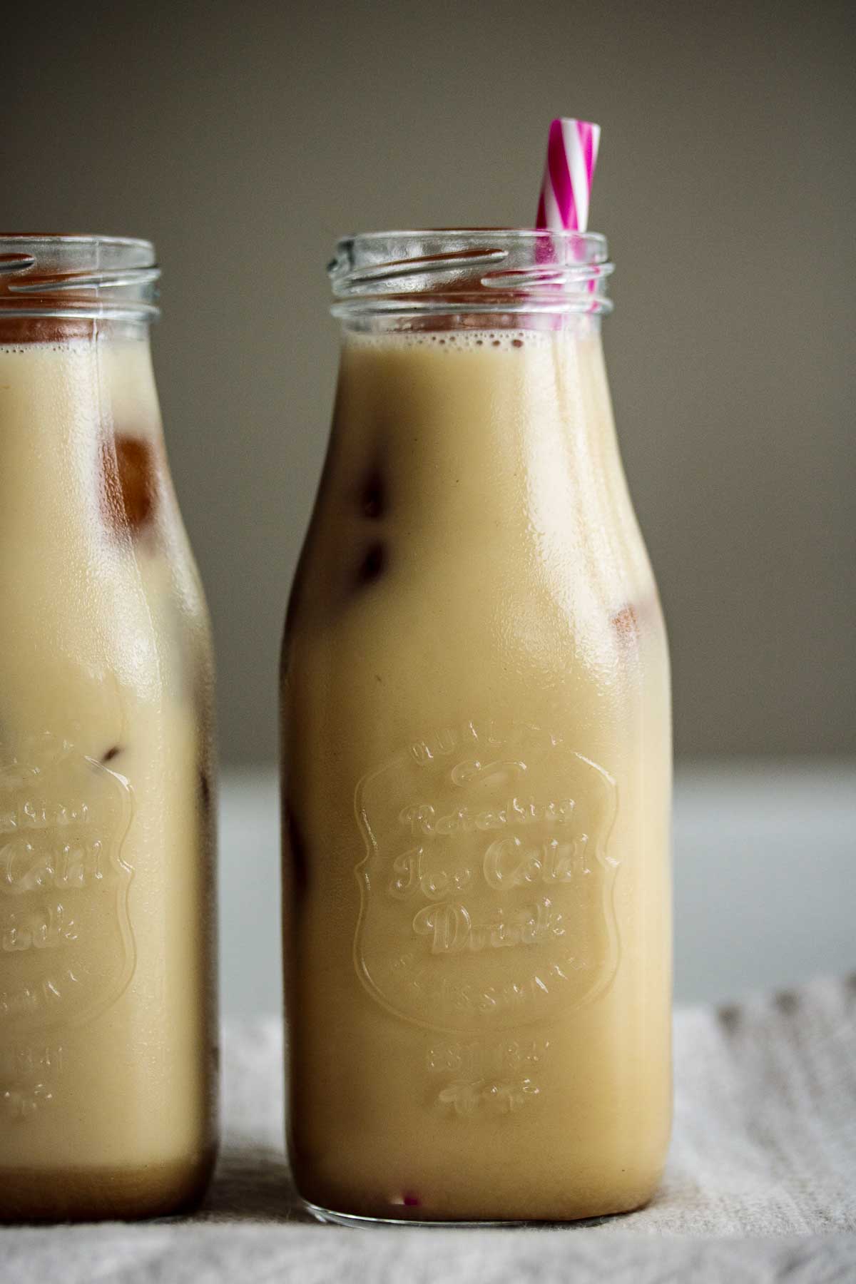 Beverages ready to drink with pink reusable straw.