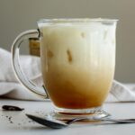 A glass of iced london fog over ice.