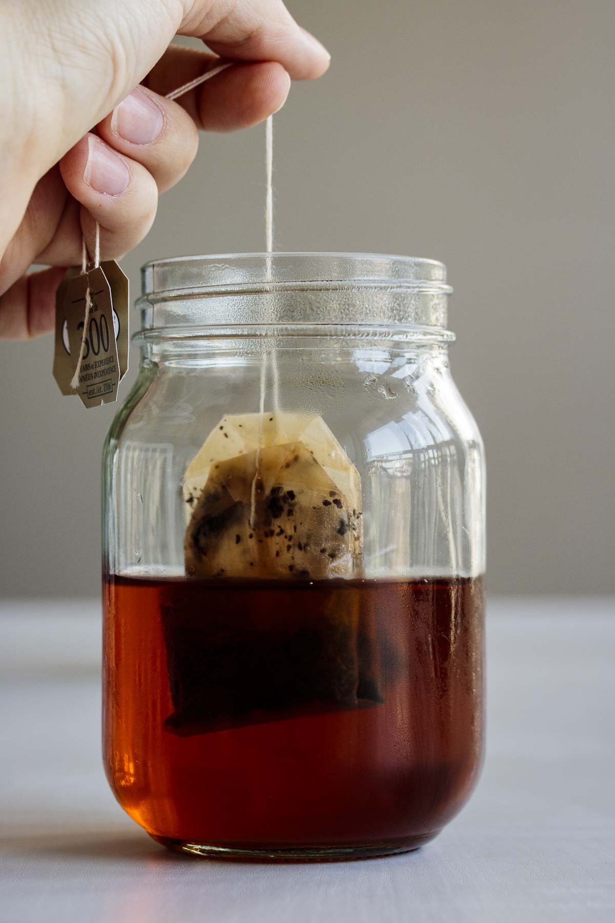 Tea bags being removed from cold brew tea.