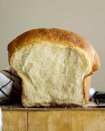 Vegan brioche bun sliced showing its crumb.
