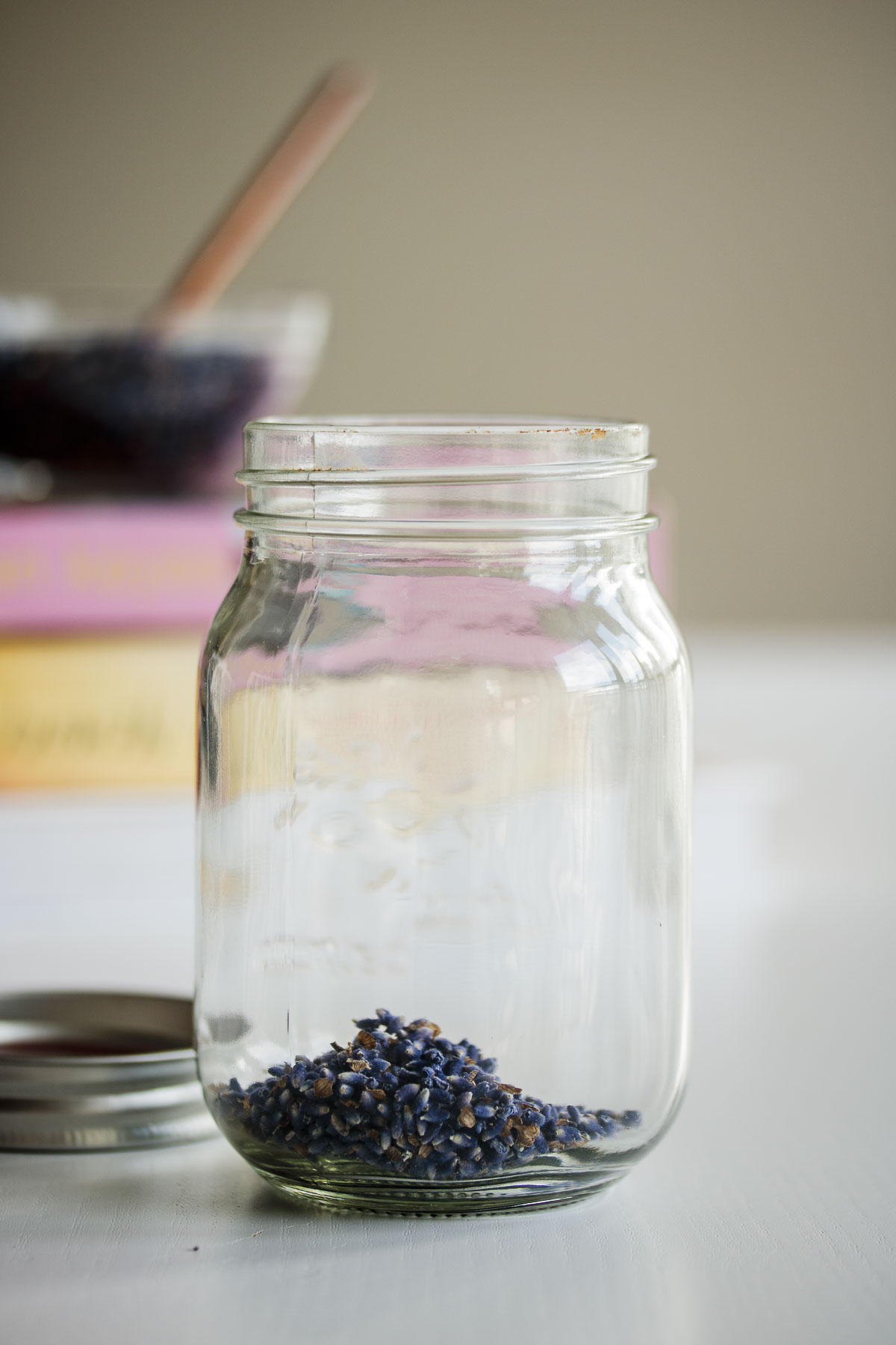 A glass jar with fresh lavender.