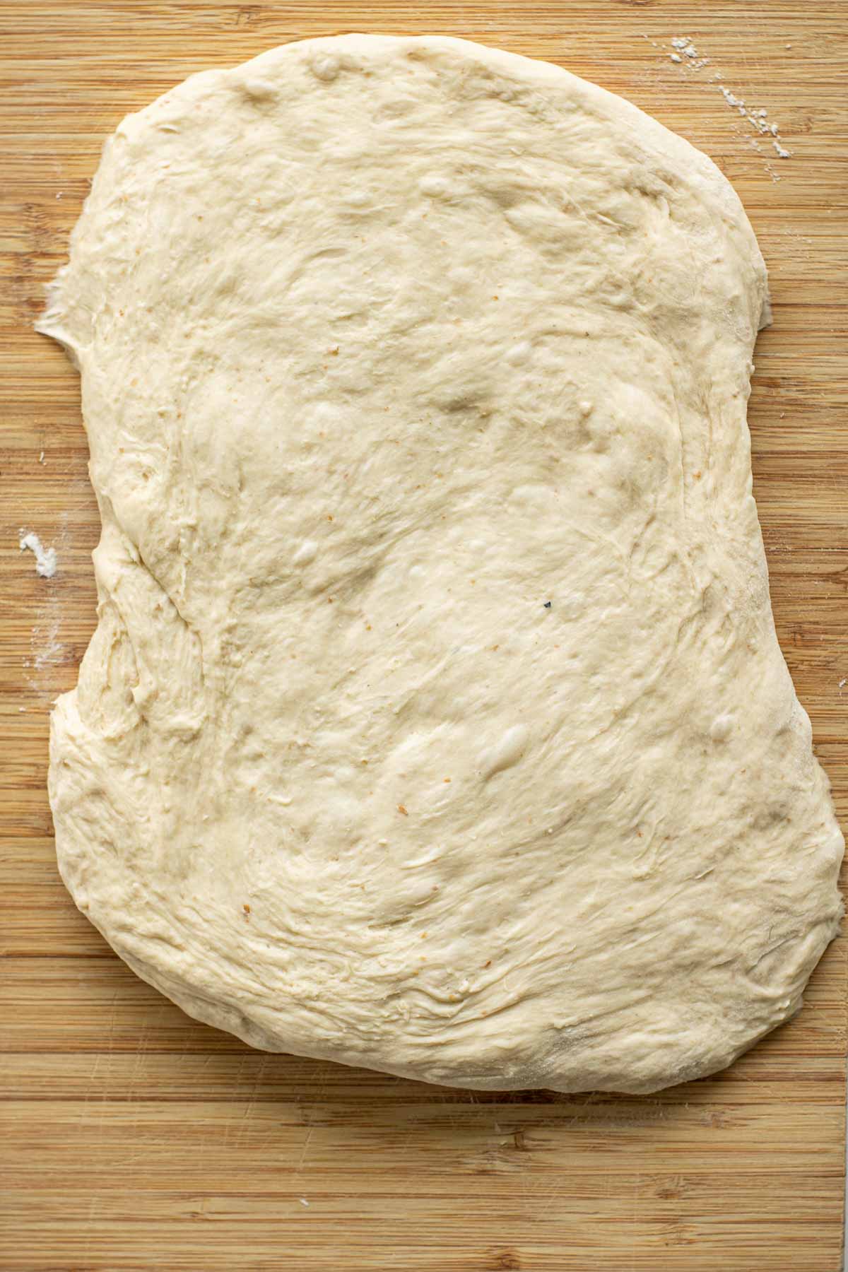 Opened dough in a rectangular shape.