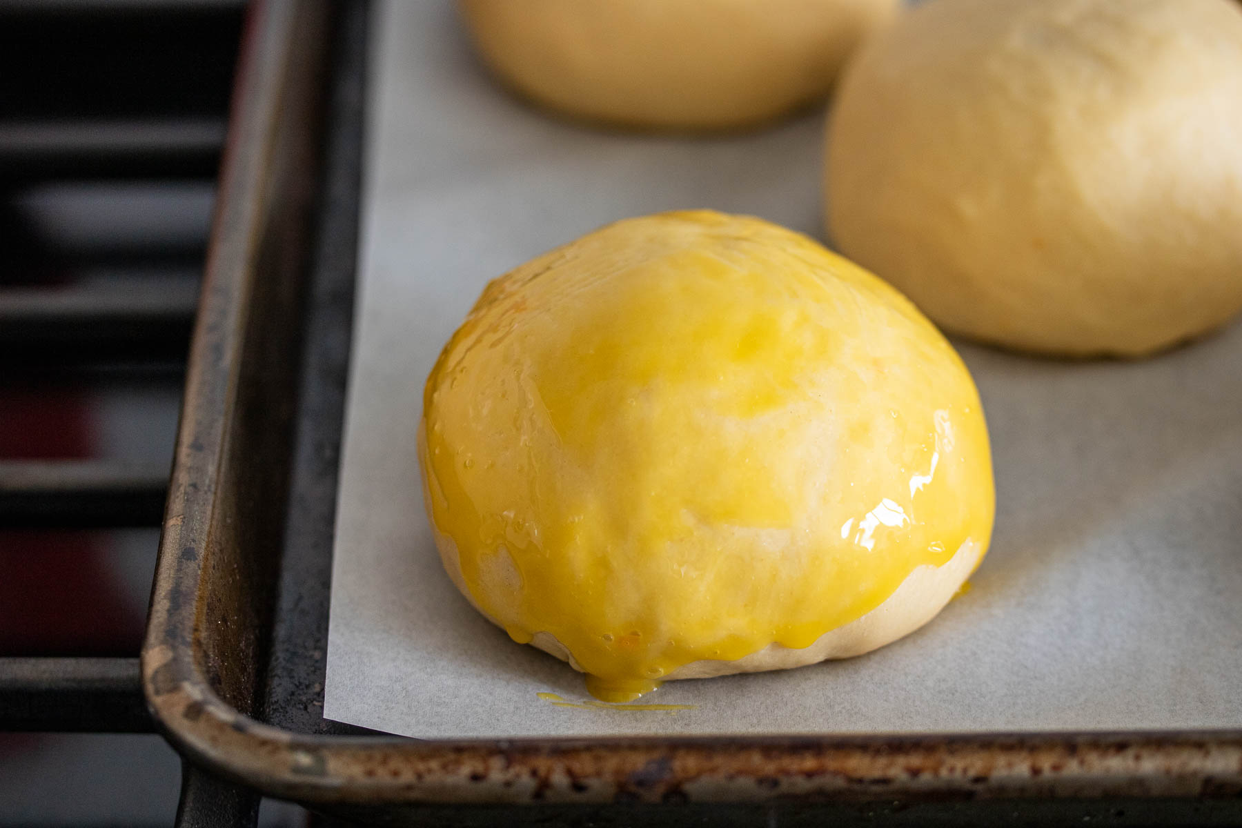 Shaped bun, brushed with egg wash.