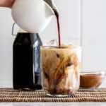 Coconut sugar syrup pouring over beverage.