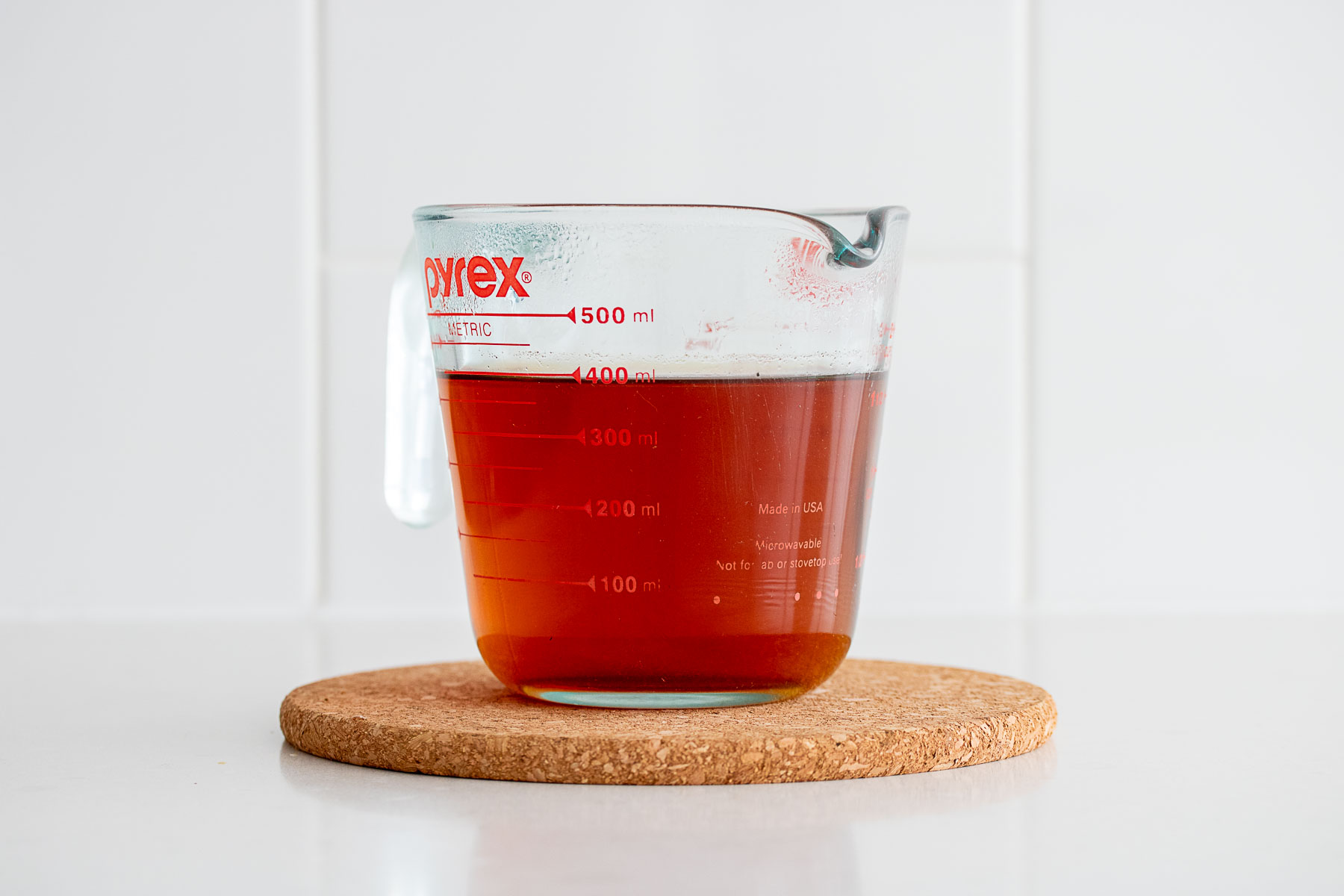 Tea cooling in a glass jar.