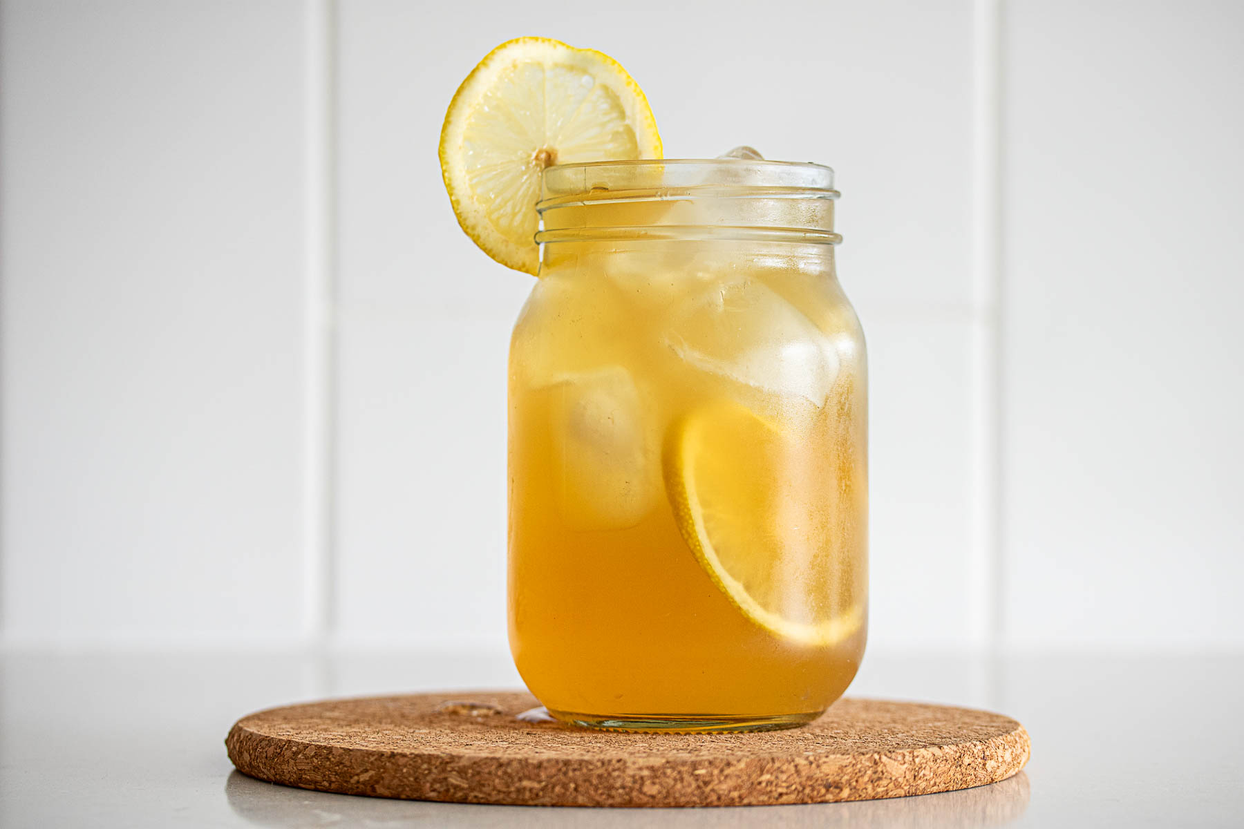 A glass of lemonade, ready to drink.