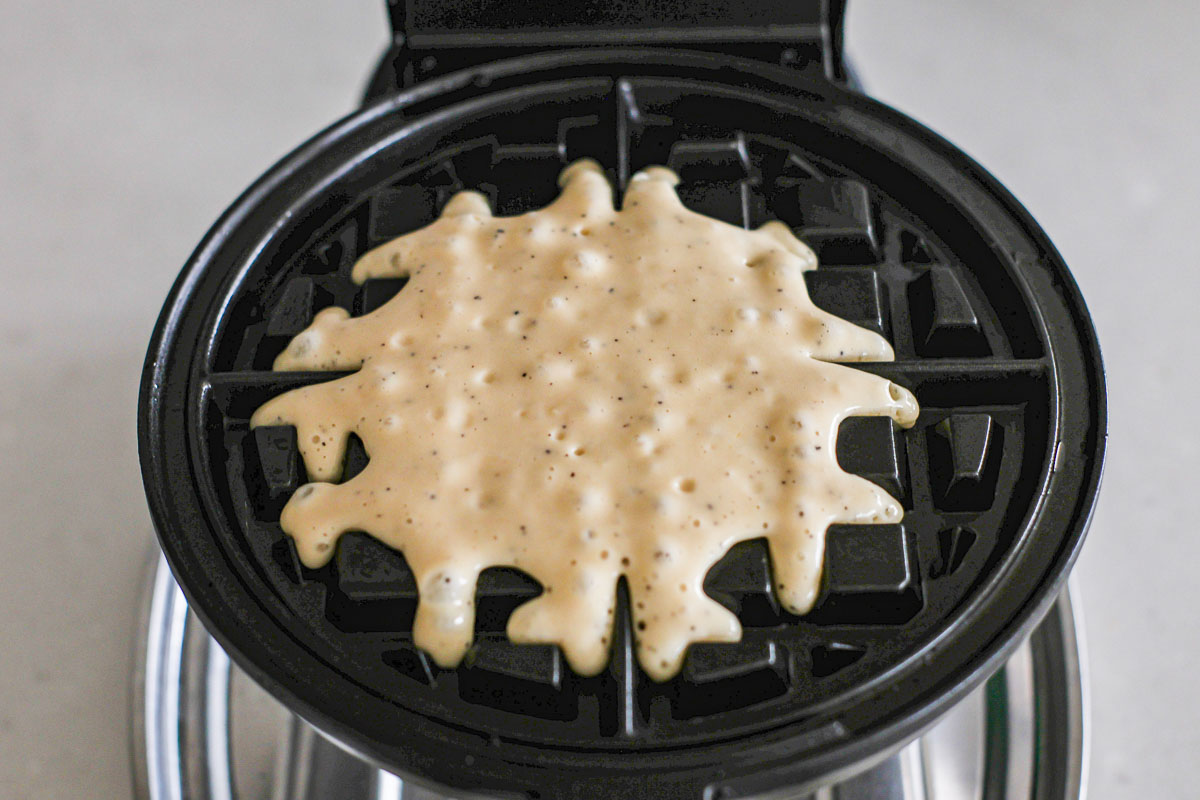 Earl Grey waffle batter poured into a waffle iron.