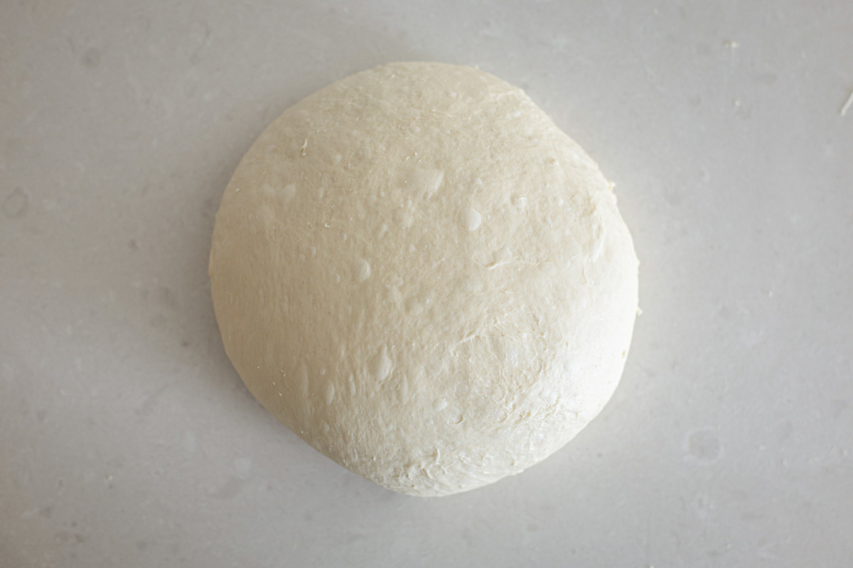 Dough shaped in a ball.