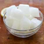 A bowl with lemonade ice cubes.