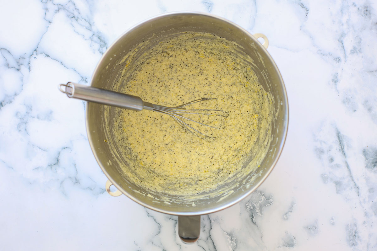 Batter and whisk in a metal bowl.