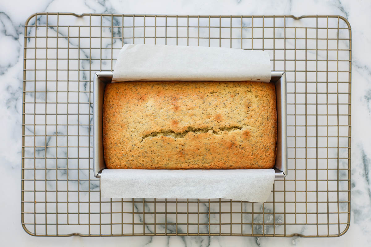 Cake ready, still inside the baing pan, over cooling rack.