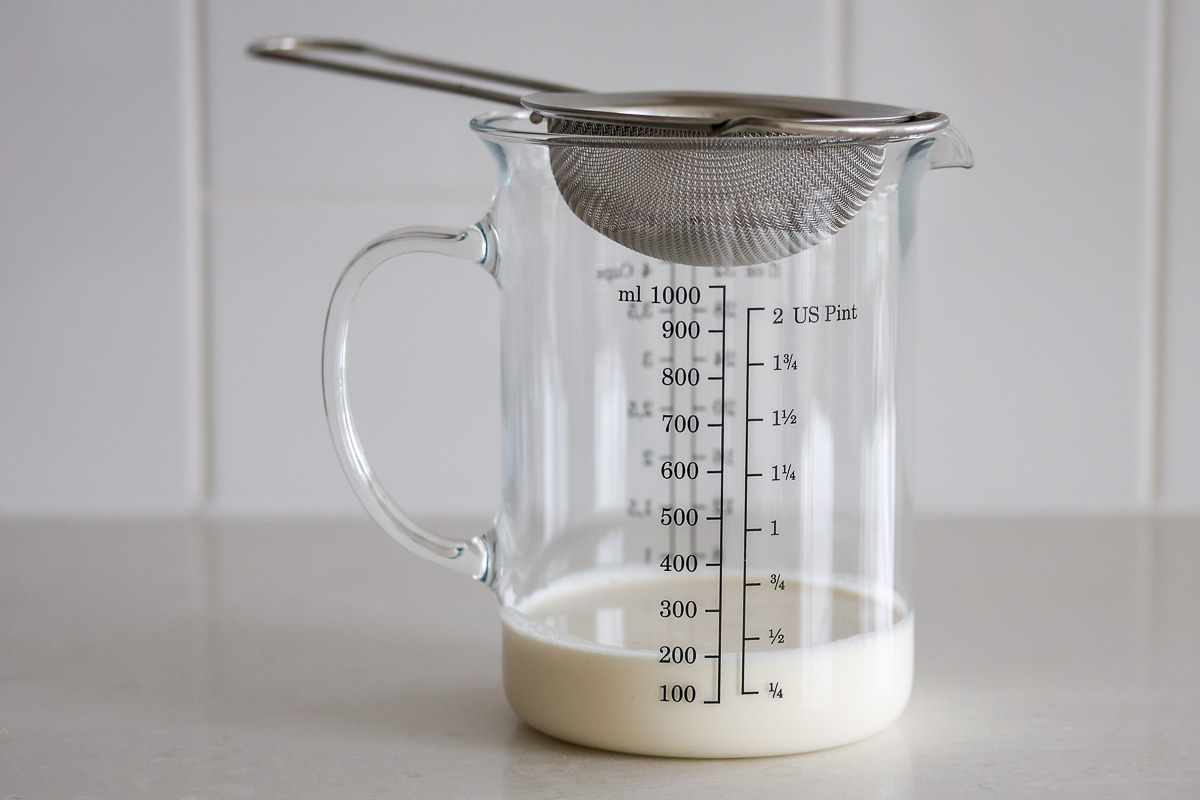 A metal mesh strain, a glass container and heavy cream.