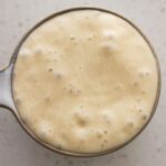 Active sourdought starter with bubbles.