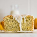 The crumb of a glazed sourdough lemon cake with poppy seeds.