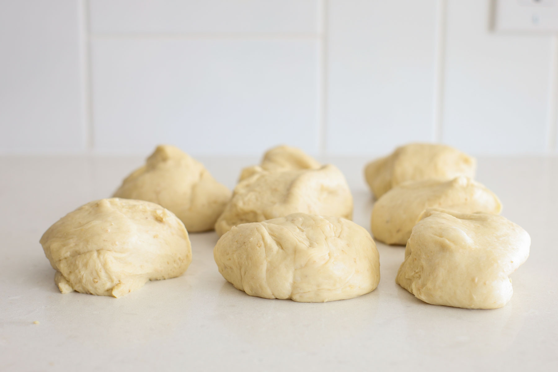 Dough portioned into 8 equal parts.