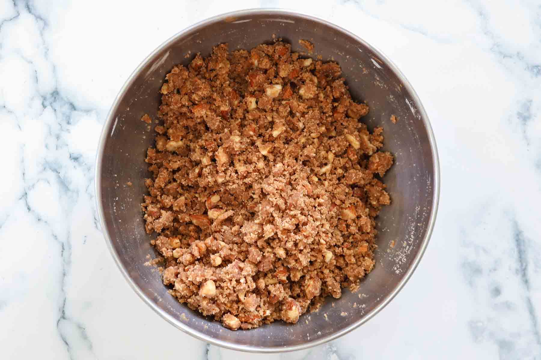 Streusel in a metal bowl.