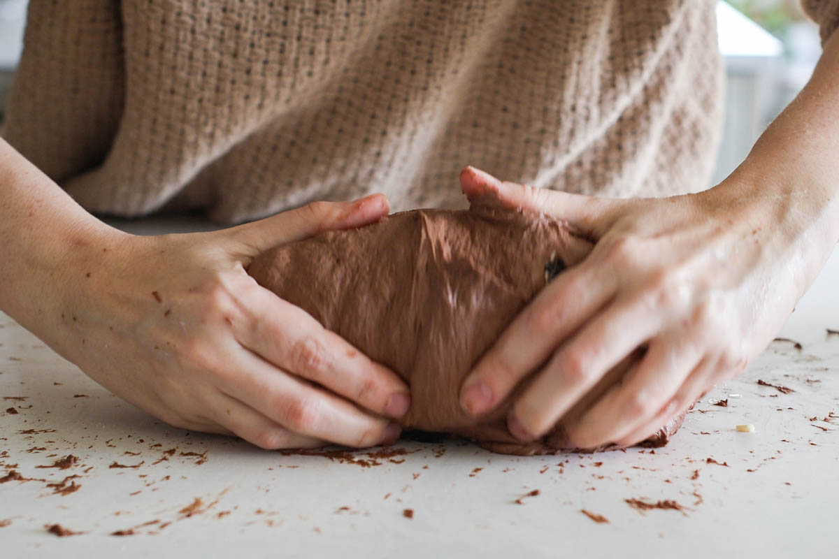 Hand pulling dough.