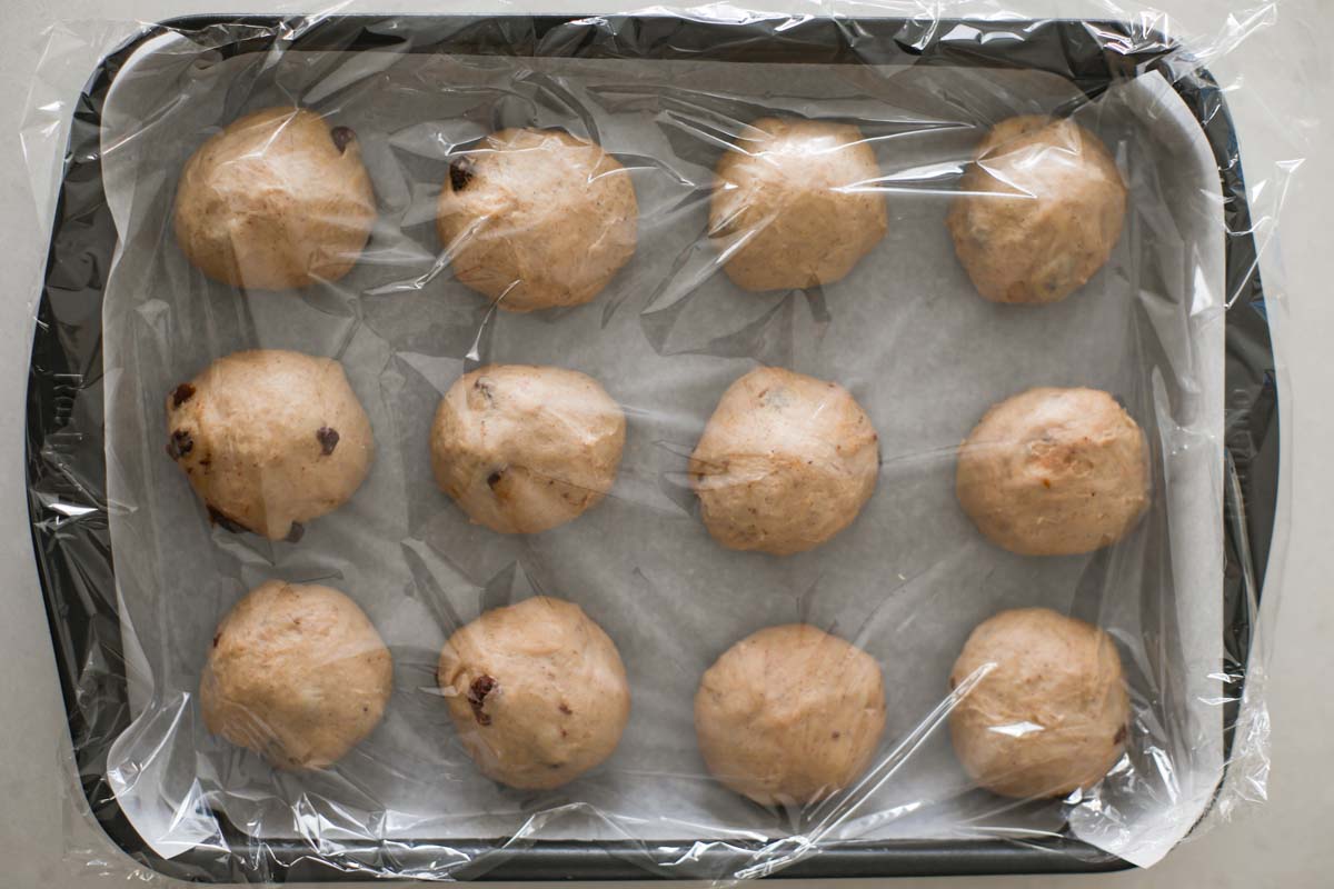 Dough balls inside a baking pan.