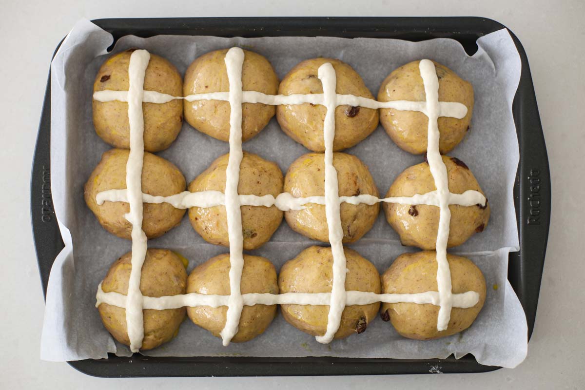 Dough balls with flour crosses.