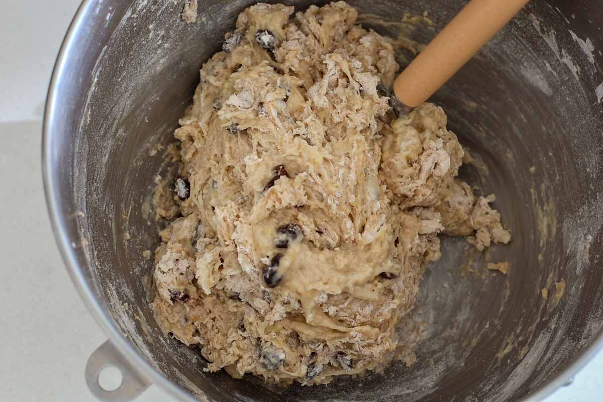 Shaggy dough inside metal bowl.