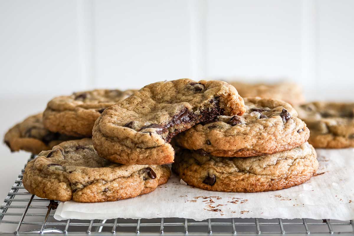 Sourdough brown butter chocolate chip cookies showing the chewy interior of one.