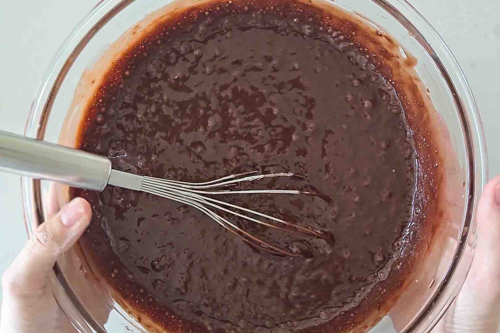 Cupcake batter inside a glass bowl.